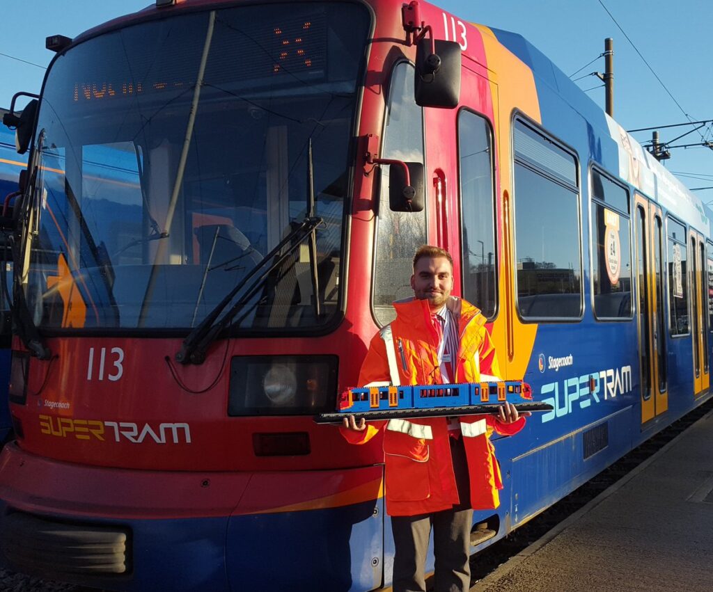 Stagecoach Supertram worker in front of the train