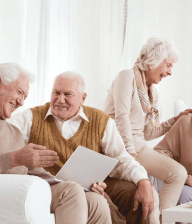 elderly people laughing together