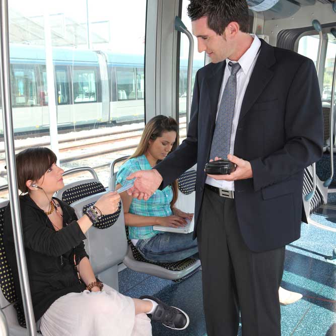 ticket inspector collecting ticket from passanger