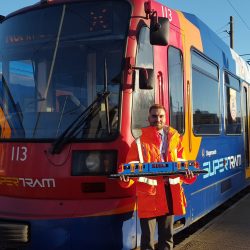 Stagecoach Supertram worker in front of the train