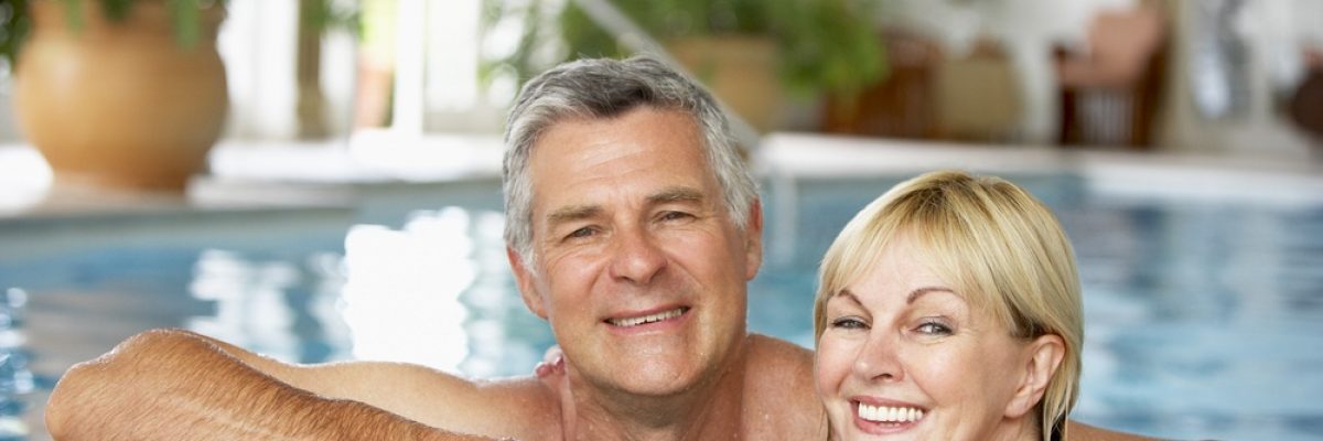 couple in swimming pool smiling